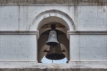 Obraz premium Weathered bronze voices that have echoed for centuries — the bells of Yanque Cathedral stand as timeless guardians over the heart of Colca Valley.
