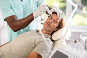 Cosmetologist used Hydrogen Oxygen Hydrating attachment to revitalize client's skin during facial...