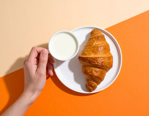 Buttery Croissant and Milk on a Two-Tone Background