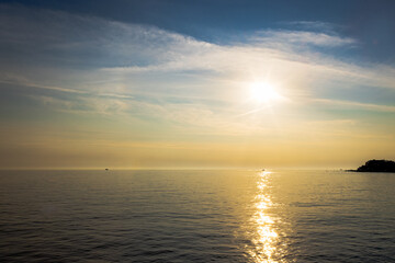 Naklejka premium Sunset Reflection Over Calm Sea 