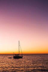Serene Sailboat at Sunset with Vibrant Sky 
