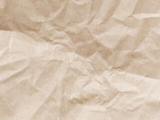 Brown crumpled paper pattern. Crumpled old brown vintage paper surface texture for background....