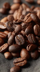 Naklejka premium A close up of dark brown roasted coffee bean. Whole beans detail. Morning beverage ingredient background for menu design.