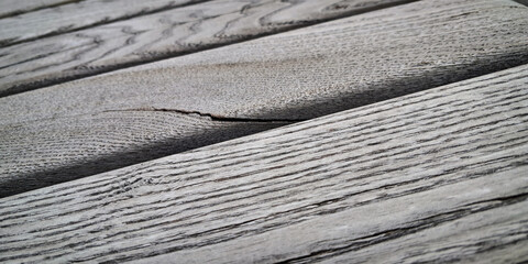 Fototapeta premium Close-up of weathered wooden planks with textured wavy lines