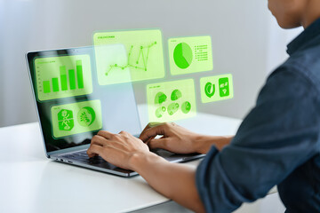 Person using laptop with green eco-friendly data analytics dashboard; sustainable business growth concept.