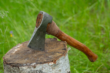 Finnish axe close-up on green grass.