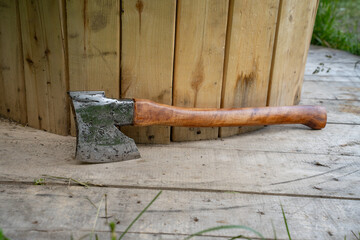 Finnish axe near wooden boards