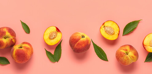 Sweet peaches and leaves on pink background