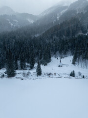 winter landscape in the mountains in austria drone view and small scenic chapel