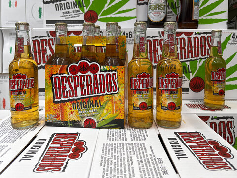 Desperados beer bottles arranged on beer cartons. French tequila flavored drink. Udine, Italy. June 19_2025