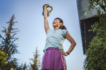 Japanese mature woman train with kettle bell do exercise for arms