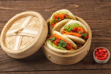 Korean Pao.Bao buns with chicken crispy and vegetable. Asian cuisine