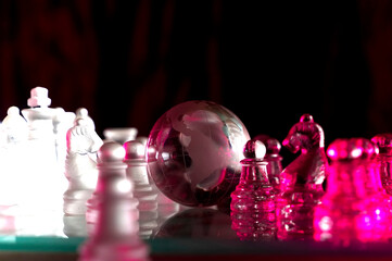 Crystal planet Earth amidst chess pieces showing the American continent, representing concepts of geopolitics, global power, competition for control, international relations, world leaders, struggle f