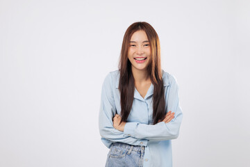 Confident smile from asian woman with crossed arms, a portrait of strength and poise, arms crossed in a powerful yet positive pose. isolated white background