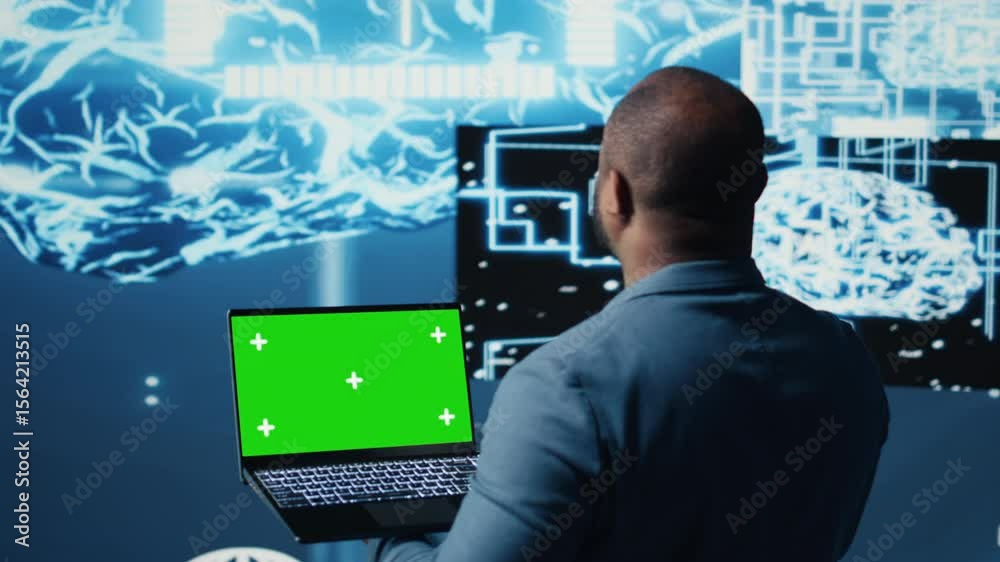 Poster black male engineer showing laptop with chroma key display next to predictive analytics immersed in 