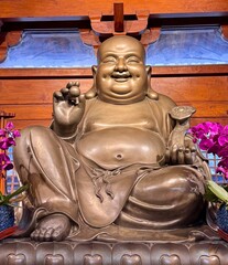 Laughing Buddha gold in colour 