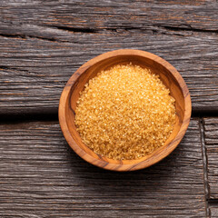 Organic cane panela powder in the bowl - Saccharum officinarum