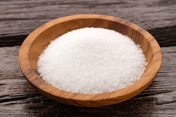 Fine crystals of refined white sugar in a bowl