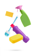 Household cleaning tools falling isolated on white background
