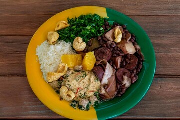 The best traditional Brazilian feijoada completely served in the most authentic style accompanied by the irresistible and iconic cachaça caipirinha