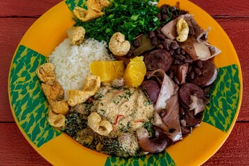 The best traditional Brazilian feijoada completely served in the most authentic style accompanied by the irresistible and iconic cachaça caipirinha