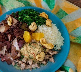 The best traditional Brazilian feijoada completely served in the most authentic style accompanied by the irresistible and iconic cachaça caipirinha