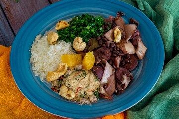 The best traditional Brazilian feijoada completely served in the most authentic style accompanied by the irresistible and iconic cachaça caipirinha