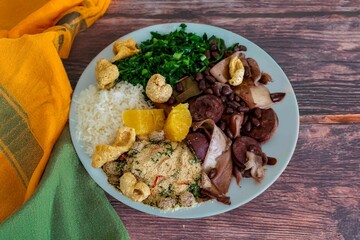The best traditional Brazilian feijoada completely served in the most authentic style accompanied by the irresistible and iconic cachaça caipirinha