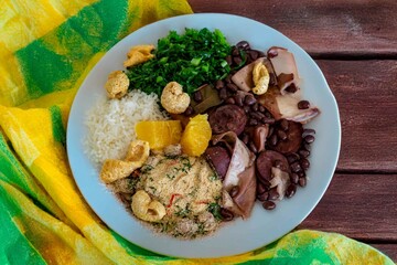 The best traditional Brazilian feijoada completely served in the most authentic style accompanied by the irresistible and iconic cachaça caipirinha