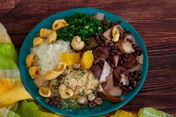The best traditional Brazilian feijoada completely served in the most authentic style accompanied by the irresistible and iconic cachaça caipirinha