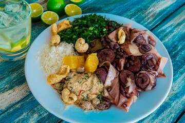The best traditional Brazilian feijoada completely served in the most authentic style accompanied by the irresistible and iconic cachaça caipirinha