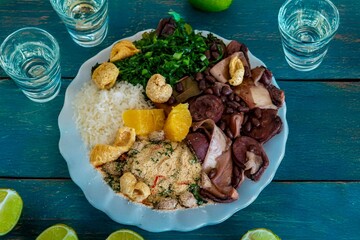 The best traditional Brazilian feijoada completely served in the most authentic style accompanied by the irresistible and iconic cachaça caipirinha