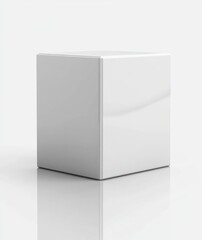 Naklejka premium Glossy white cube with reflective surface on smooth white background casting subtle shadow with soft lighting