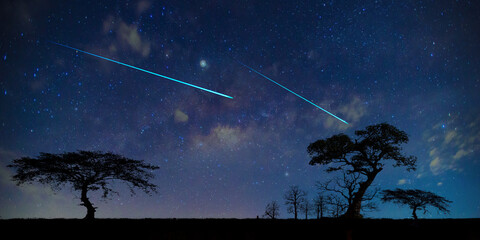 comet on  blue night sky milky way and star on dark background.Universe filled with stars, nebula...