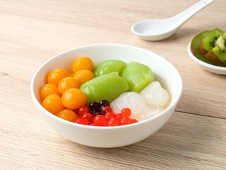 Colorful Asian Dessert Bowl on Wood Table