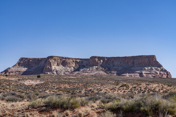 Fototapeta premium LeChee Rock is a sandstone feature located south of Lake Powell, in Coconino County of northern Arizona. A mesa is an isolated, flat-topped elevation, ridge, or hill. 