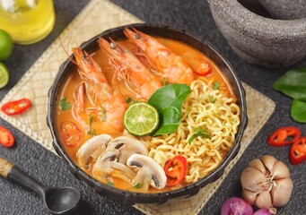 Tom yum kung with noodles , thai style instant spicy noodles with shrimp , noodles tom yum with shrimp
