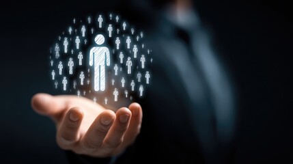 Human Resources in Hand: a businessman presenting the human resources icon symbolizing employees, talent management, teamwork, in the palm of his hand.