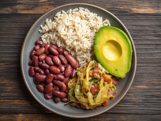 Resistant starch. Healthy meal featuring beans, rice, and avocado on a plate.