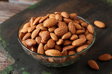 Close Up of Roasted Almond Nuts on Rustic Background