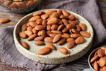 Close Up of Roasted Almond Nuts on Rustic Background