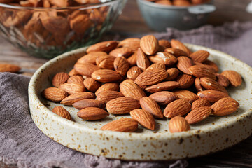 Close Up of Roasted Almond Nuts on Rustic Background