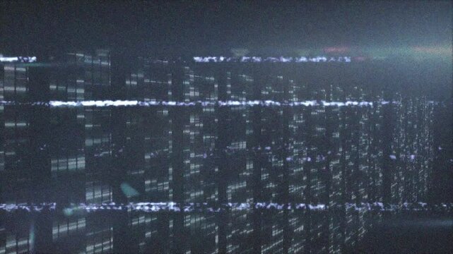 Initial glitch line snaking across data wall, pixel clusters flickering and visualizing corruption