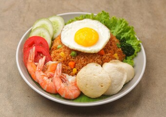 Nasi Goreng. Fried rice is a dish of rice fried in a wok or frying pan which produces a different taste because it is mixed with spices such as salt, garlic, shallots, pepper, certain spices.