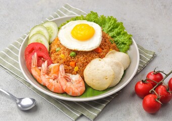 Nasi Goreng. Fried rice is a dish of rice fried in a wok or frying pan which produces a different taste because it is mixed with spices such as salt, garlic, shallots, pepper, certain spices.