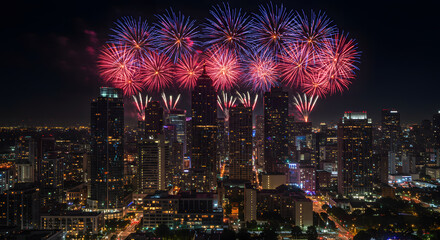 Fototapeta premium Spectacular Fireworks Over a Bright City Skyline at Night, Celebrating a Special Event or Holiday