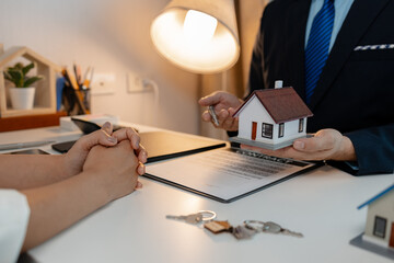 staff is explaining the information about the house lease contract documents to the buyer, the...