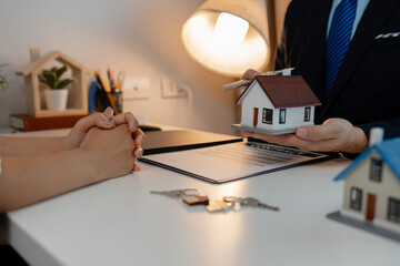 staff is explaining the information about the house lease contract documents to the buyer, the...