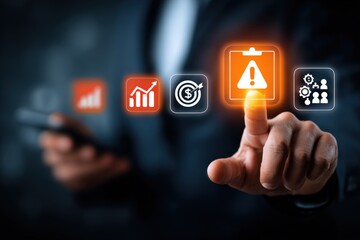 Close-up of a person's hand interacting with a futuristic transparent digital warning alert icon on a smartphone screen with business and data analytics icons in the background