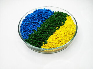 various colors of masterbatch granules in glass containers, polymer carrying resin and pigments...